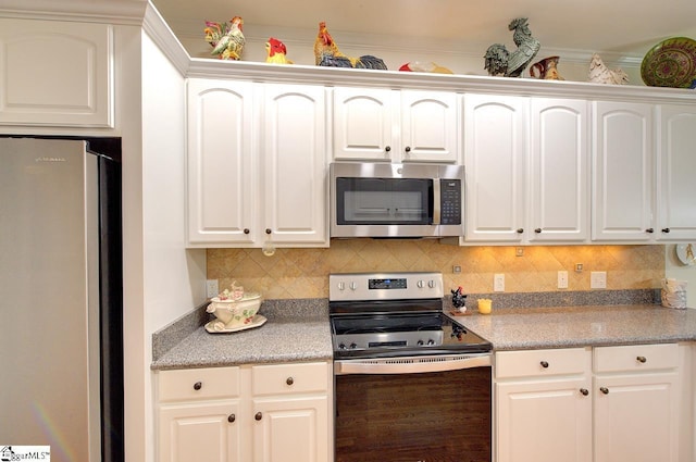 132 Hartsfield Dr, Easley, SC 29642 - kitchen with decorative backsplash, white cabinetry, and stainless steel appliances