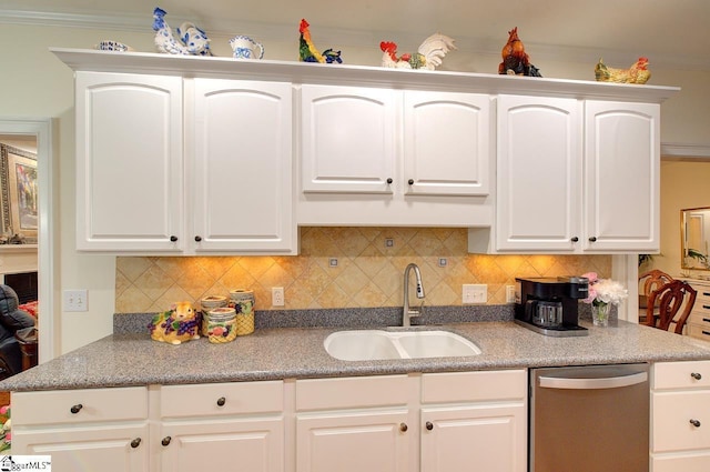 132 Hartsfield Dr, Easley, SC 29642 - kitchen with a sink, tasteful backsplash, stainless steel dishwasher, and white cabinetry
