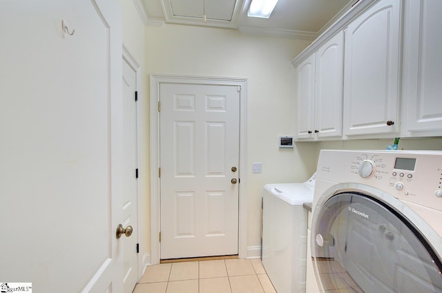 132 Hartsfield Dr, Easley, SC 29642 - washroom featuring ornamental molding, baseboards, separate washer and dryer, cabinet space, and light tile patterned floors
