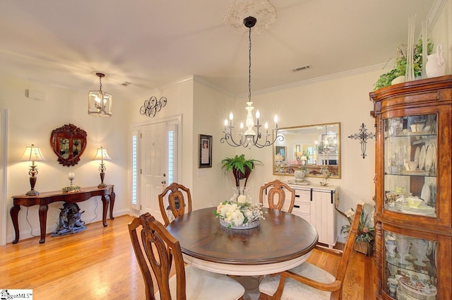 132 Hartsfield Dr, Easley, SC 29642 - dining room with baseboards, visible vents, light wood-style flooring, and a notable chandelier