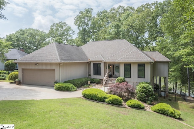 1210 Beaver Run, Anderson, SC 29625 - ranch-style home with a front lawn, fence, roof with shingles, concrete driveway, and an attached garage