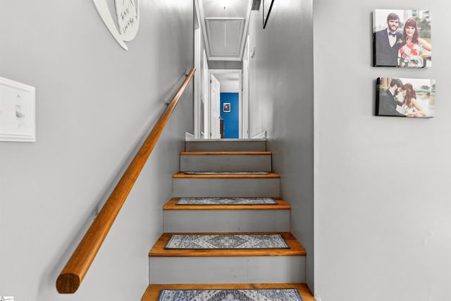 staircase featuring attic access