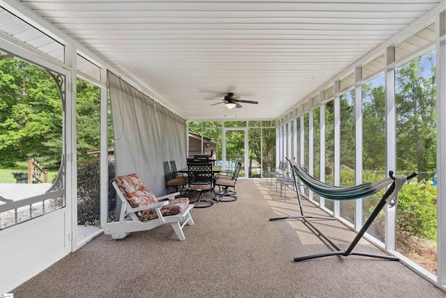 sunroom with ceiling fan and a healthy amount of sunlight