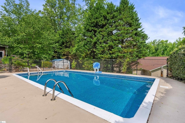 view of swimming pool featuring a fenced in pool and fence