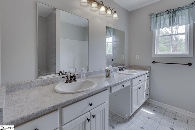 101 Merganser Ct, Liberty, SC 29657 - bathroom featuring a sink, baseboards, tile patterned flooring, and double vanity