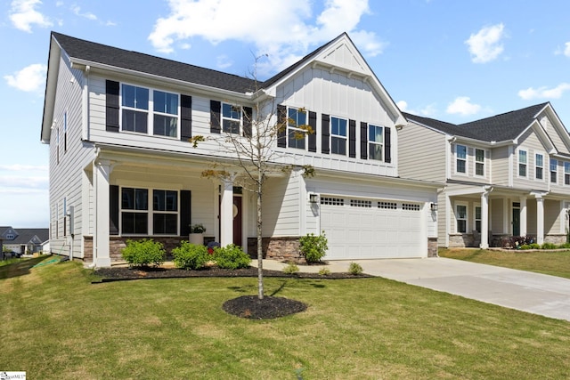 craftsman-style house with concrete driveway, an attached garage, a front yard, and stone siding