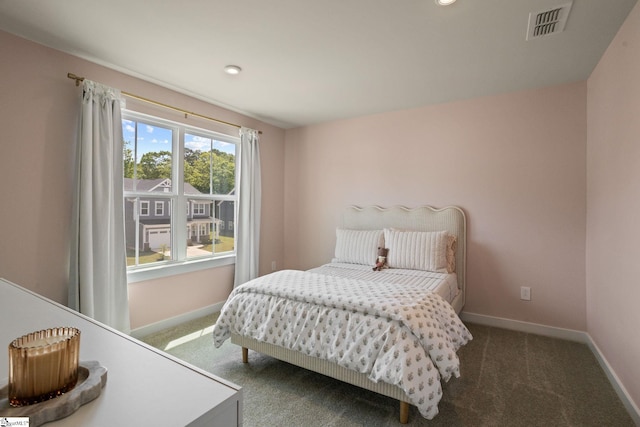 carpeted bedroom featuring recessed lighting, baseboards, and visible vents