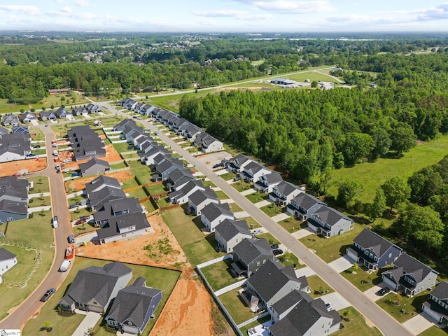 aerial view featuring a residential view and a forest view