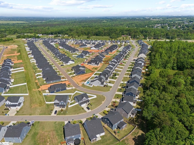 bird's eye view with a residential view and a wooded view