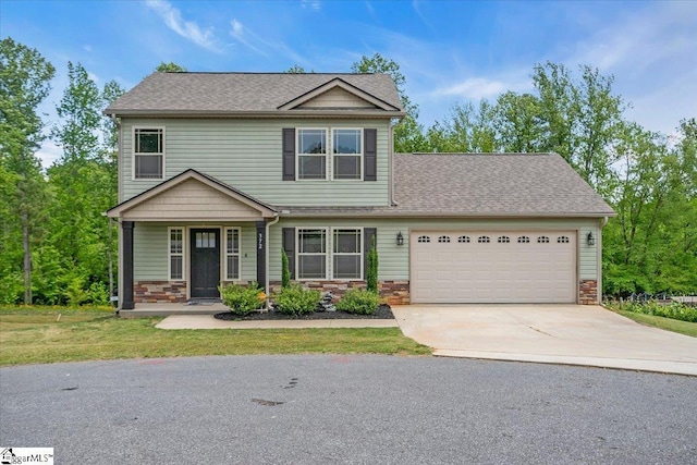 372 Long Branch Rd, Chesnee, SC 29323 - view of front of house featuring roof with shingles, a front yard, a garage, concrete driveway, and stone siding
