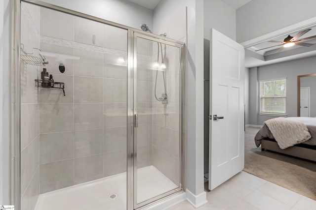 full bath with baseboards, a ceiling fan, connected bathroom, and a stall shower