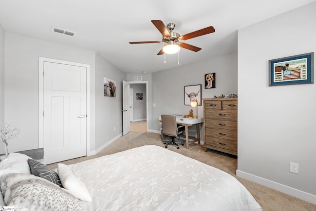 bedroom featuring light colored carpet, baseboards, visible vents, and a ceiling fan