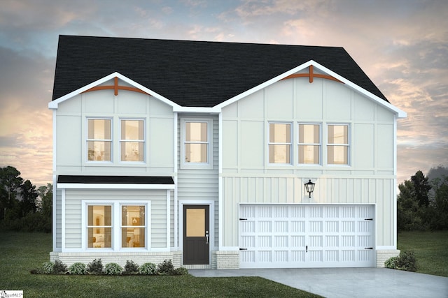 view of front of property with board and batten siding, an attached garage, driveway, and roof with shingles