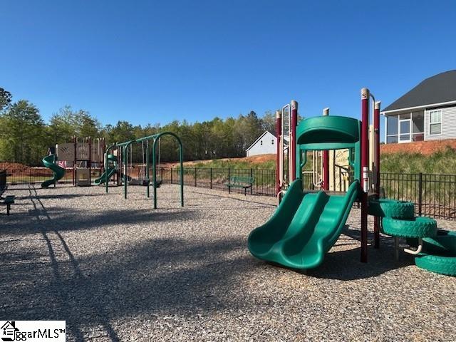 community jungle gym featuring fence