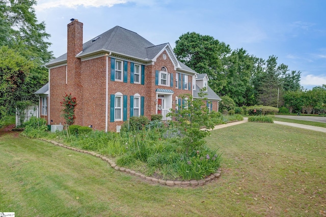 5 Bellfort Ct, Taylors, SC 29687 - view of side of property with brick siding, a lawn, roof with shingles, and a chimney