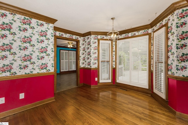 5 Bellfort Ct, Taylors, SC 29687 - unfurnished dining area with crown molding, a chandelier, a wainscoted wall, wallpapered walls, and wood finished floors