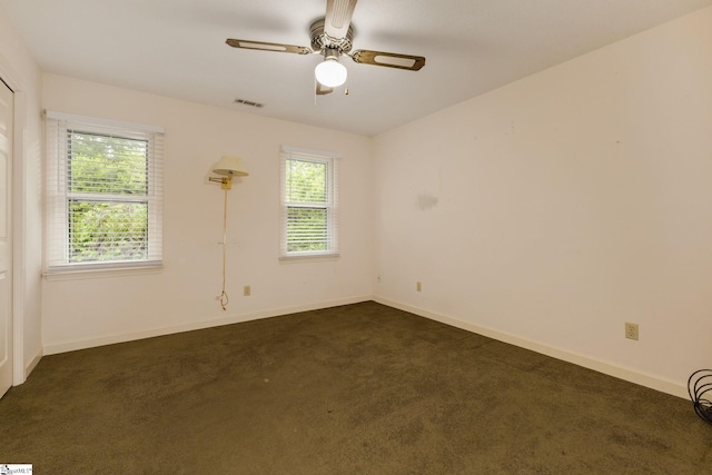 5 Bellfort Ct, Taylors, SC 29687 - unfurnished room featuring visible vents, plenty of natural light, dark carpet, and ceiling fan