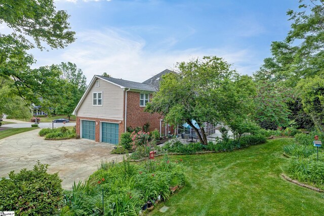 5 Bellfort Ct, Taylors, SC 29687 - view of side of property with brick siding, a garage, a yard, and concrete driveway