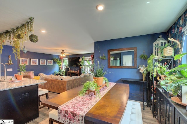 dining space with recessed lighting, a ceiling fan, and light wood finished floors