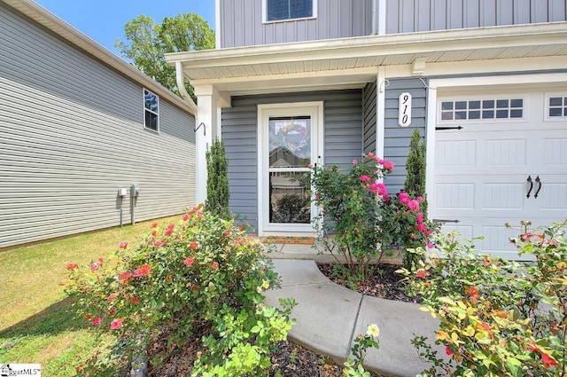 property entrance featuring board and batten siding