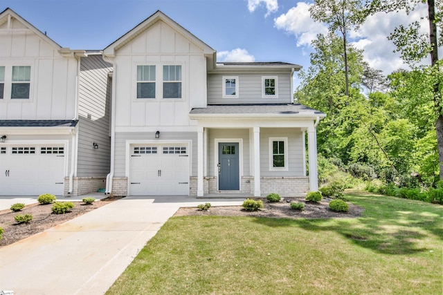 modern farmhouse style home with board and batten siding, a garage, brick siding, a front lawn, and concrete driveway