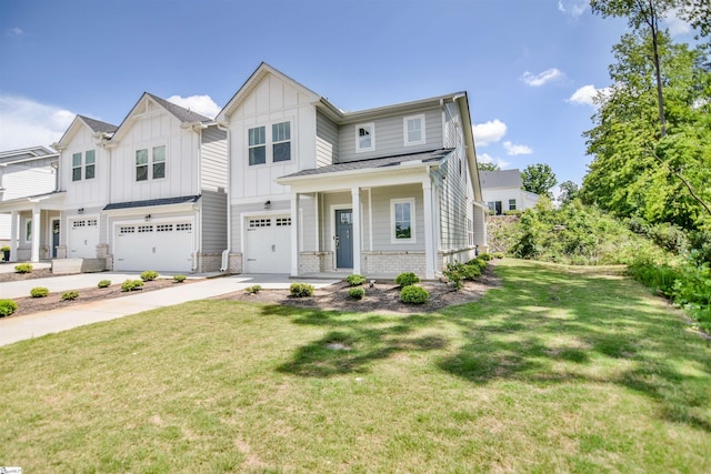 view of front facade with concrete driveway, board and batten siding, a front yard, and a garage