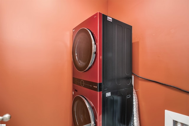 laundry room with laundry area and stacked washer / dryer