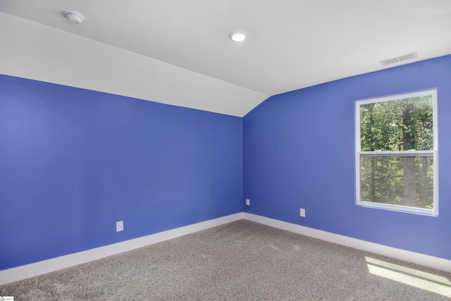 bonus room with visible vents, carpet, baseboards, and lofted ceiling