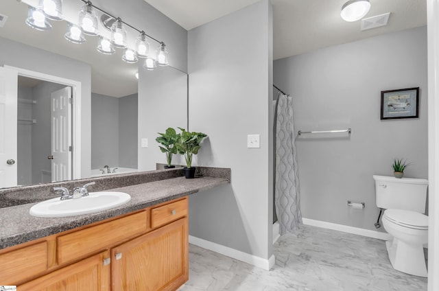 bathroom with vanity, toilet, marble finish floor, baseboards, and visible vents