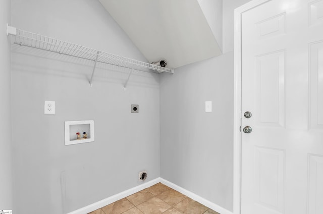 laundry area featuring washer hookup, hookup for an electric dryer, laundry area, light tile patterned floors, and baseboards