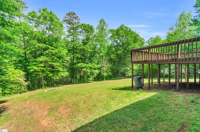 view of yard featuring a wooden deck