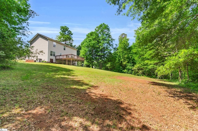view of yard featuring a wooden deck