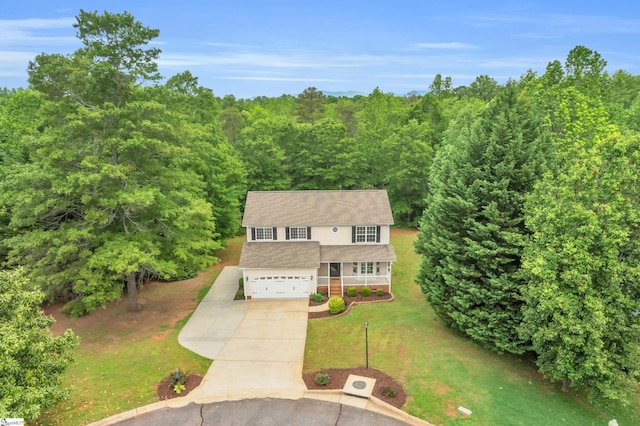 drone / aerial view featuring a view of trees