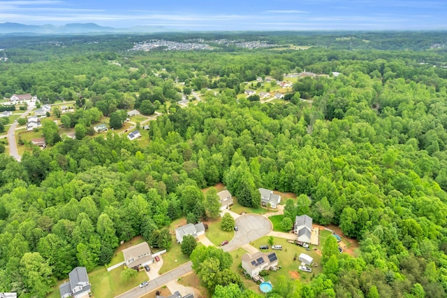 drone / aerial view with a view of trees