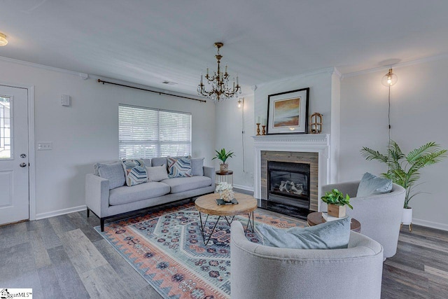 106 Hickory Valley Way, Taylors, SC 29687 - living room featuring an inviting chandelier, ornamental molding, baseboards, and wood finished floors