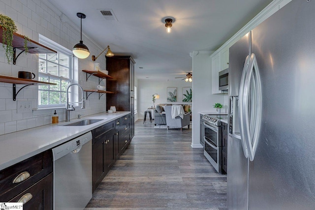 106 Hickory Valley Way, Taylors, SC 29687 - kitchen featuring open shelves, a sink, stainless steel appliances, decorative backsplash, and wood finished floors