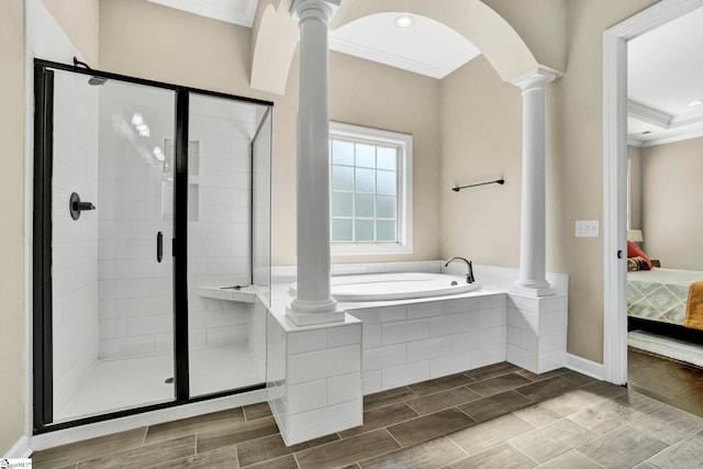 ensuite bathroom featuring crown molding, ensuite bath, decorative columns, a shower stall, and a bath