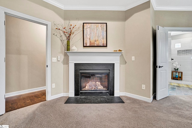 details with crown molding, baseboards, carpet flooring, and a fireplace with flush hearth