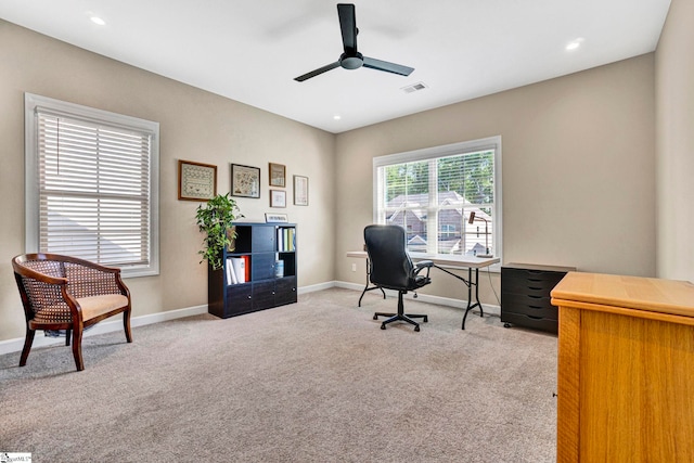 home office featuring visible vents, carpet flooring, baseboards, and ceiling fan