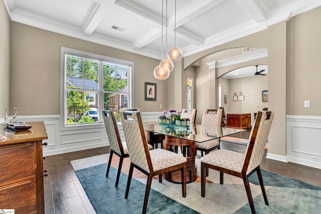 dining space featuring arched walkways, dark wood finished floors, coffered ceiling, and beamed ceiling
