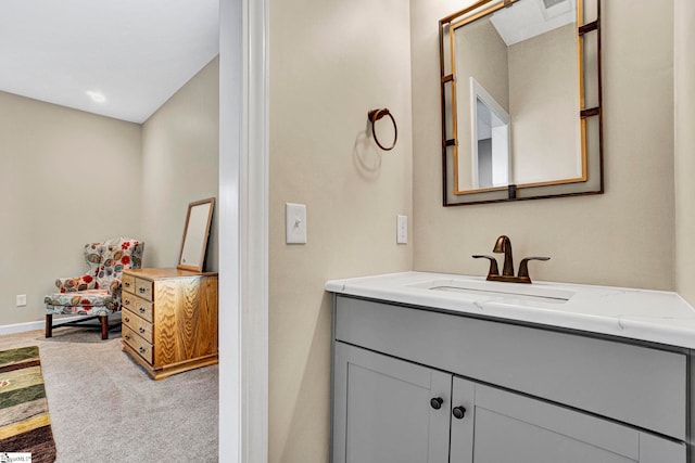 bathroom featuring baseboards, visible vents, and vanity