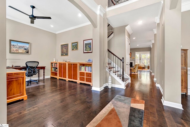 entrance foyer with ceiling fan, ornamental molding, and hardwood / wood-style floors