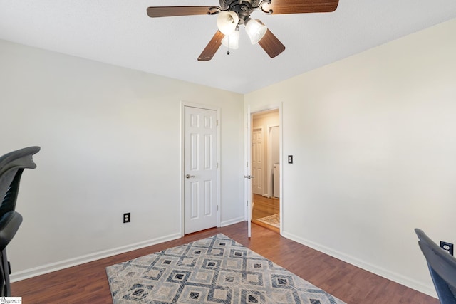 bedroom with baseboards, a ceiling fan, and wood finished floors