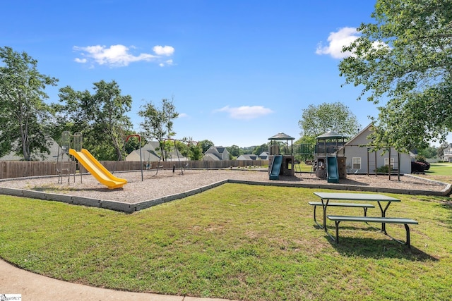community playground with fence and a yard