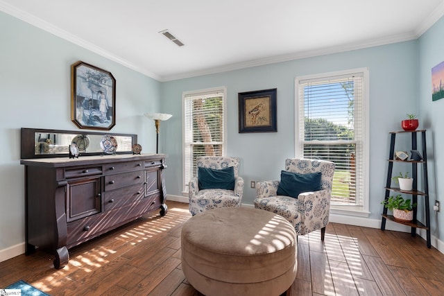 living area featuring crown molding, baseboards, dark wood-style floors, and visible vents