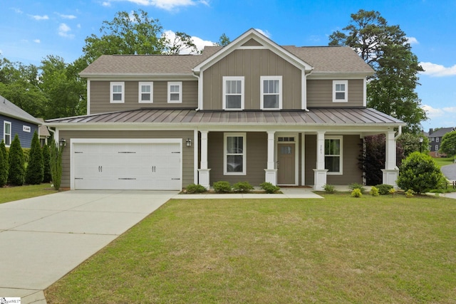 view of front of home featuring concrete driveway, a standing seam roof, board and batten siding, and a front yard