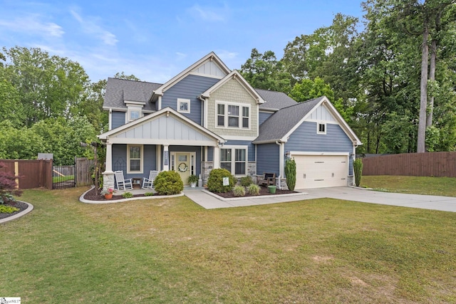 324 Runion Lake Ct, Taylors, SC 29687 - craftsman-style home with fence, board and batten siding, a front yard, concrete driveway, and covered porch
