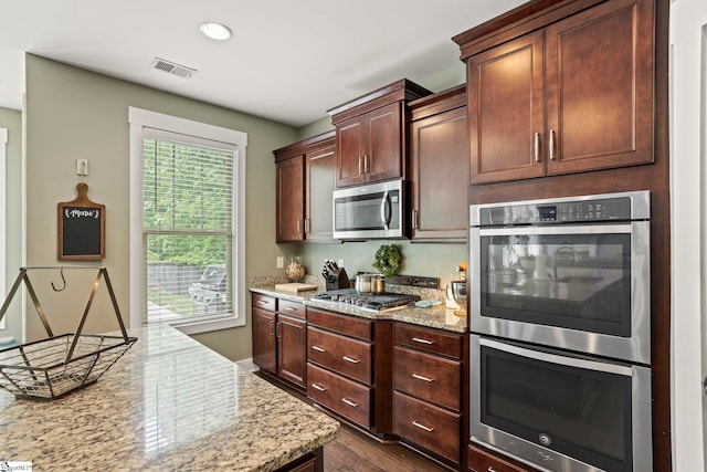 324 Runion Lake Ct, Taylors, SC 29687 - kitchen with visible vents, light stone countertops, dark wood-style floors, recessed lighting, and appliances with stainless steel finishes