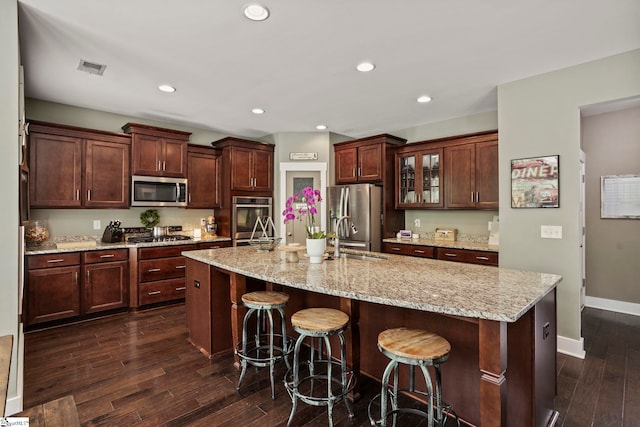 324 Runion Lake Ct, Taylors, SC 29687 - kitchen featuring a sink, a breakfast bar, visible vents, dark wood finished floors, and appliances with stainless steel finishes