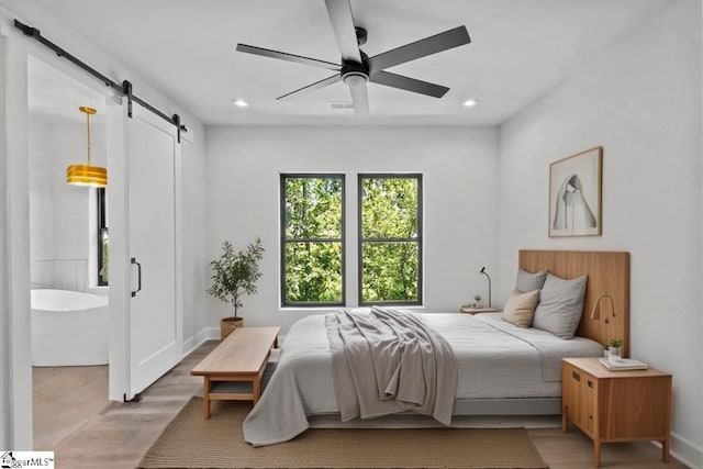 bedroom featuring visible vents, a barn door, ceiling fan, and recessed lighting